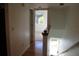 Hallway with wood floors and access to other rooms at 9720 Indian Key Trl # 117, Seminole, FL 33776