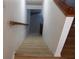 Beige carpeted staircase leading to the lower level at 9720 Indian Key Trl # 117, Seminole, FL 33776