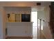 Simple kitchen with white cabinets and black appliances at 9720 Indian Key Trl # 117, Seminole, FL 33776