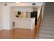 Galley kitchen with breakfast bar and view of living room at 9720 Indian Key Trl # 117, Seminole, FL 33776