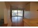 Living room with wood floors and sliding glass doors at 9720 Indian Key Trl # 117, Seminole, FL 33776