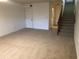 Bright living room with carpeted floors and access to the garage at 9720 Indian Key Trl # 117, Seminole, FL 33776