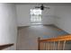 Spacious living room with carpeted floors and access to a patio at 9720 Indian Key Trl # 117, Seminole, FL 33776