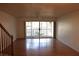 Bright living room with hardwood floors and access to a balcony at 9720 Indian Key Trl # 117, Seminole, FL 33776