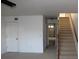 Living area with carpeted floors and interior access to the garage at 9720 Indian Key Trl # 117, Seminole, FL 33776