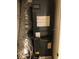 Interior view of a closet containing the HVAC unit at 9720 Indian Key Trl # 117, Seminole, FL 33776