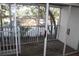Spacious screened balcony overlooks a tree-filled yard at 9720 Indian Key Trl # 117, Seminole, FL 33776