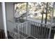 Screened porch overlooking a backyard with trees and homes at 9720 Indian Key Trl # 117, Seminole, FL 33776
