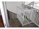 Wooden spiral staircase leading down to ground level at 9720 Indian Key Trl # 117, Seminole, FL 33776