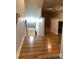 View down a staircase with light wood flooring at 9720 Indian Key Trl # 117, Seminole, FL 33776