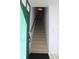 Carpeted staircase leading to the upper level at 9720 Indian Key Trl # 117, Seminole, FL 33776