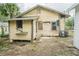 Exterior of a fixer-upper house needing renovations at 440 Cypress St, Tarpon Springs, FL 34689