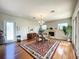 Cozy dining room with a fireplace, chandelier, and large windows for natural light at 2066 N Pointe Alexis Dr, Tarpon Springs, FL 34689