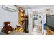 Bedroom with a double bed, toy shelf, and view to hallway at 1320 Woodbine St, Clearwater, FL 33755