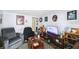 Living room with TV, shelving, and comfortable seating at 1320 Woodbine St, Clearwater, FL 33755