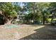 Large backyard with shed and mature trees at 1320 Woodbine St, Clearwater, FL 33755