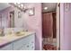 Bathroom with vanity, tub, and shower at 14130 Rosemary Ln # 3309, Largo, FL 33774