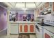 Kitchen with white appliances and coral cabinets at 14130 Rosemary Ln # 3309, Largo, FL 33774