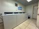 Shared laundry room with coin-operated machines at 14130 Rosemary Ln # 3309, Largo, FL 33774