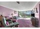 Spacious living room with a view and comfy seating at 14130 Rosemary Ln # 3309, Largo, FL 33774