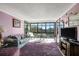 Bright living room with large windows offering scenic views and ample natural light at 14130 Rosemary Ln # 3309, Largo, FL 33774
