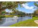 Picturesque pond with a fountain and bridge creating a serene community setting with beautiful landscaping at 14130 Rosemary Ln # 3309, Largo, FL 33774