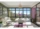 Sunroom with lake view, table and chairs, perfect for relaxing at 14130 Rosemary Ln # 3309, Largo, FL 33774