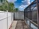 Backyard with shed, screened enclosure, and storage at 16003 2Nd E St, Redington Beach, FL 33708