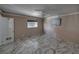 Bedroom with marble-look floors, ceiling fan, and large window at 16003 2Nd E St, Redington Beach, FL 33708