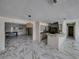 Kitchen with gray cabinets, butcher block countertops, and marble-look floors at 16003 2Nd E St, Redington Beach, FL 33708
