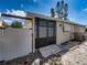Side yard with gate and access to the house at 16003 2Nd E St, Redington Beach, FL 33708