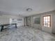 Spacious common area with marble-look floors and ample natural light at 16003 2Nd E St, Redington Beach, FL 33708