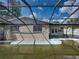 Backyard with pool and screened enclosure at 16003 2Nd E St, Redington Beach, FL 33708