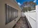 Brick pathway and a white fence at 16003 2Nd E St, Redington Beach, FL 33708