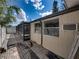 Tan house exterior with windows and A/C unit at 16003 2Nd E St, Redington Beach, FL 33708