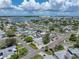 Aerial view of a single-story home with a spacious yard, located in a waterfront community at 16003 2Nd E St, Redington Beach, FL 33708