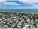 Aerial view of a waterfront home in a residential neighborhood at 16003 2Nd E St, Redington Beach, FL 33708