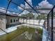 Enclosed pool area could use updating, but is spacious at 16003 2Nd E St, Redington Beach, FL 33708