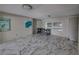 Common area with marble-look floors, large windows, and artwork at 16003 2Nd E St, Redington Beach, FL 33708
