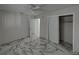 Well-lit bedroom with ceiling fan and mirrored closet doors at 16003 2Nd E St, Redington Beach, FL 33708