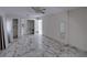 Bedroom with marble-look floors, closet, and ceiling fan at 16003 2Nd E St, Redington Beach, FL 33708