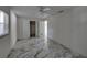 Bright bedroom with ceiling fan and tile floors at 16003 2Nd E St, Redington Beach, FL 33708