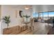 Bright dining area with glass table and hardwood floors at 9415 Blind Pass Rd # 1103, St Pete Beach, FL 33706