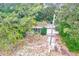 House nestled in lush, tree-filled lot at 1838 Sylvan Dr, Clearwater, FL 33755