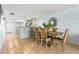 Bright dining area with kitchen access and modern light fixtures at 9495 Blind Pass Rd # 307, St Pete Beach, FL 33706
