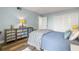 Bedroom with a full-size bed and built-in storage at 9495 Blind Pass Rd # 307, St Pete Beach, FL 33706