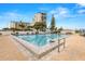 Inviting community pool with ample lounge space at 9495 Blind Pass Rd # 307, St Pete Beach, FL 33706