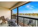 Relaxing balcony with water views and seating for two at 9495 Blind Pass Rd # 307, St Pete Beach, FL 33706