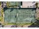Aerial view of multiple well-maintained tennis courts at 9495 Blind Pass Rd # 307, St Pete Beach, FL 33706