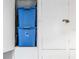 Indoor storage unit with two blue storage bins at 12405 3Rd E St # 304, Treasure Island, FL 33706